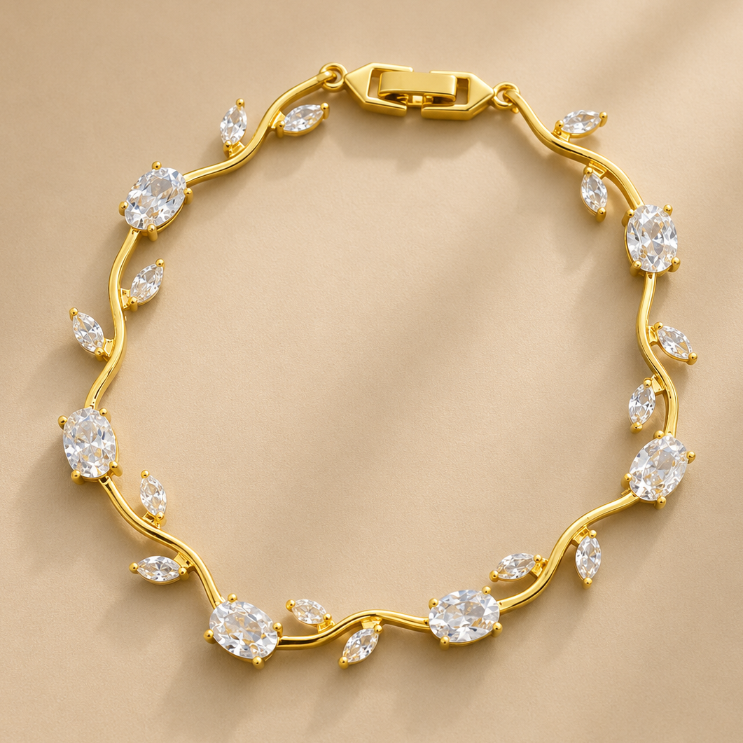 Gold bracelet with diamond-like stones on a beige background