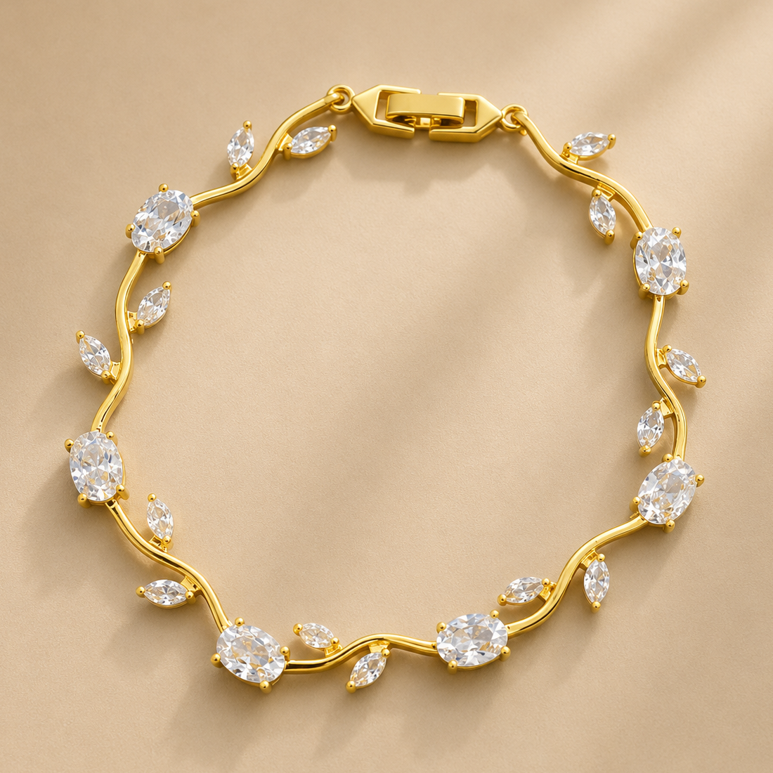 Gold bracelet with diamond-like stones on a beige background