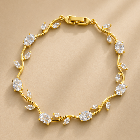 Gold bracelet with diamond-like stones on a beige background